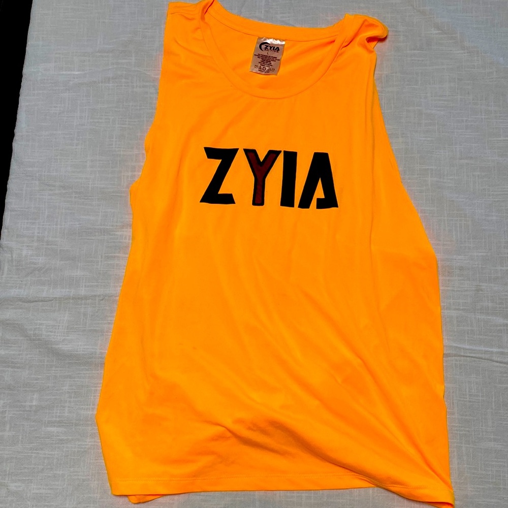Zyia Lg muscle Tshirt. Used a few times. Bright yellow/orange. Mesh "Y".